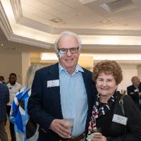 Ron and Pamela Clark standing together and smiling for photo